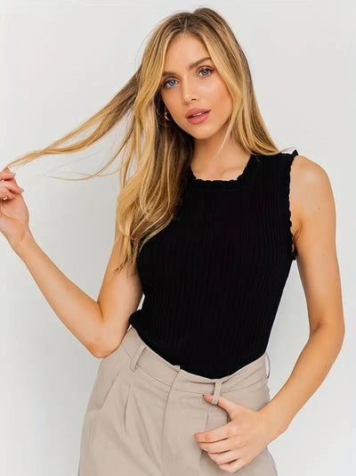 Evania – Elegancki top z falbanką i połyskiem