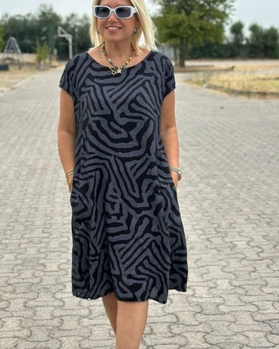 Nelia™ - Letnia sukienka z okrągłym dekoltem i pięknym nadrukiem