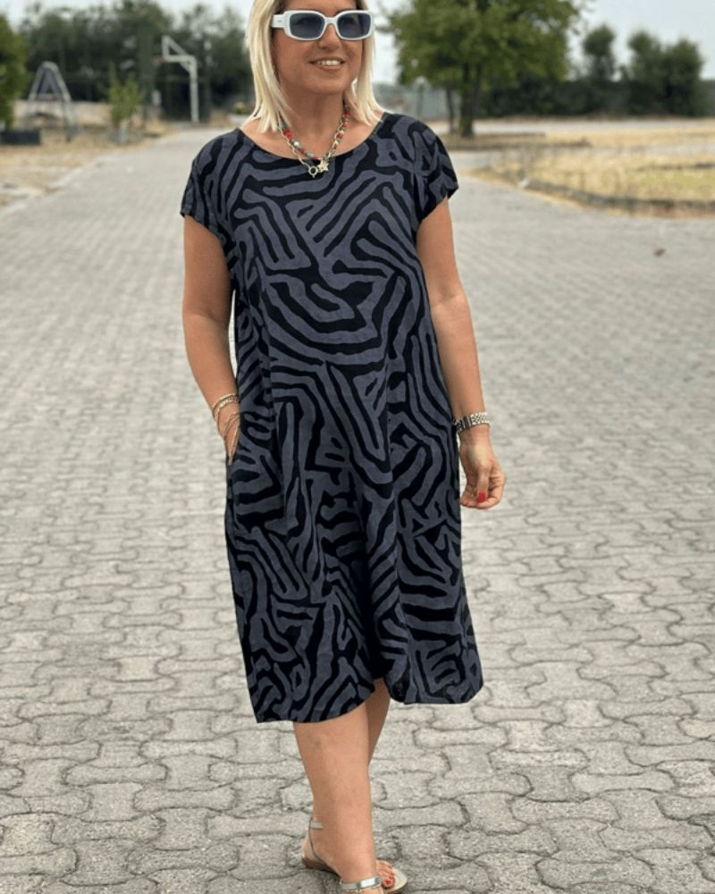 Nelia™ - Letnia sukienka z okrągłym dekoltem i pięknym nadrukiem